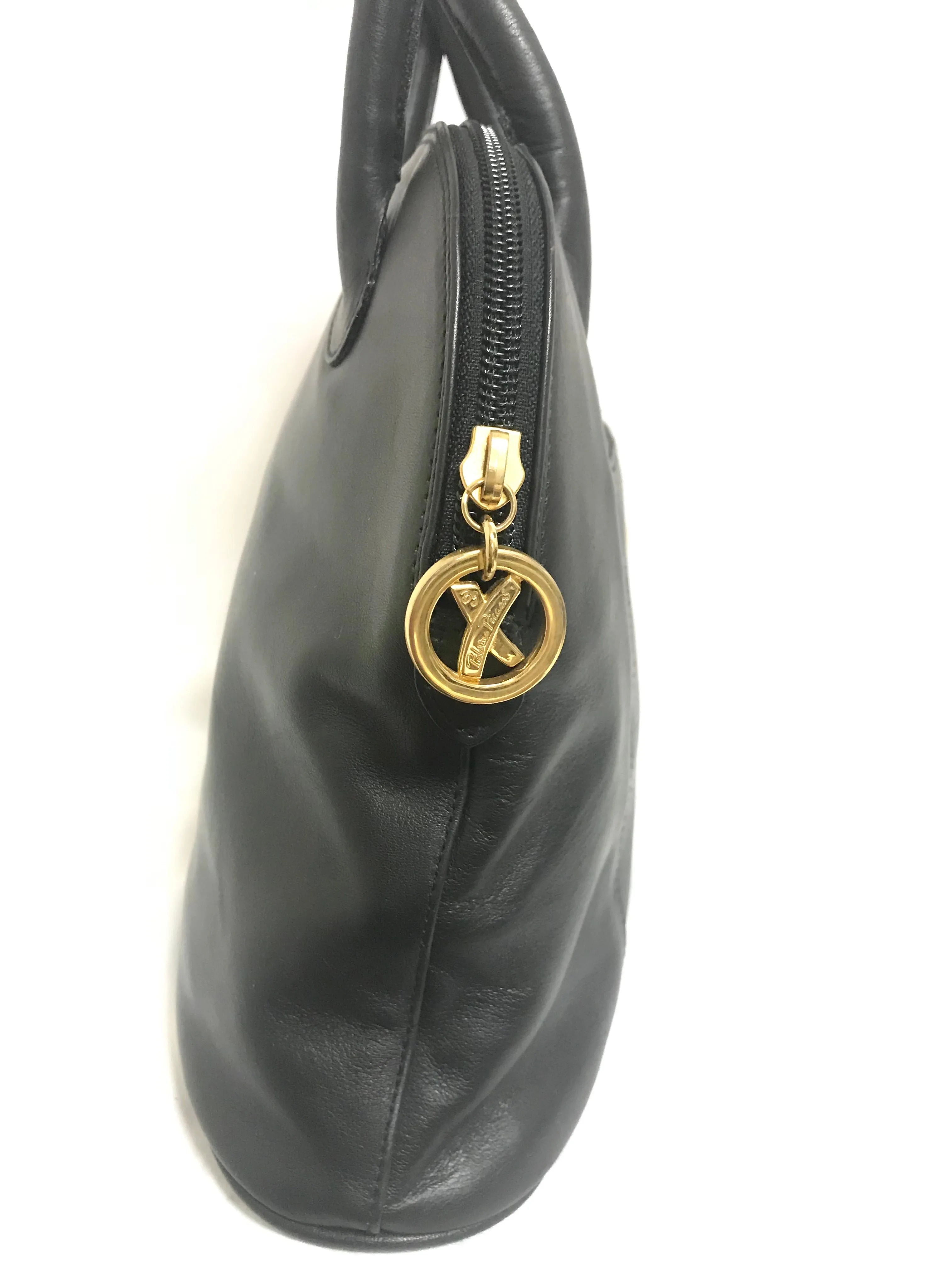 Vintage Paloma Picasso black leather bolide bag style handbag with iconic golden logo motif. Classic shape bag.