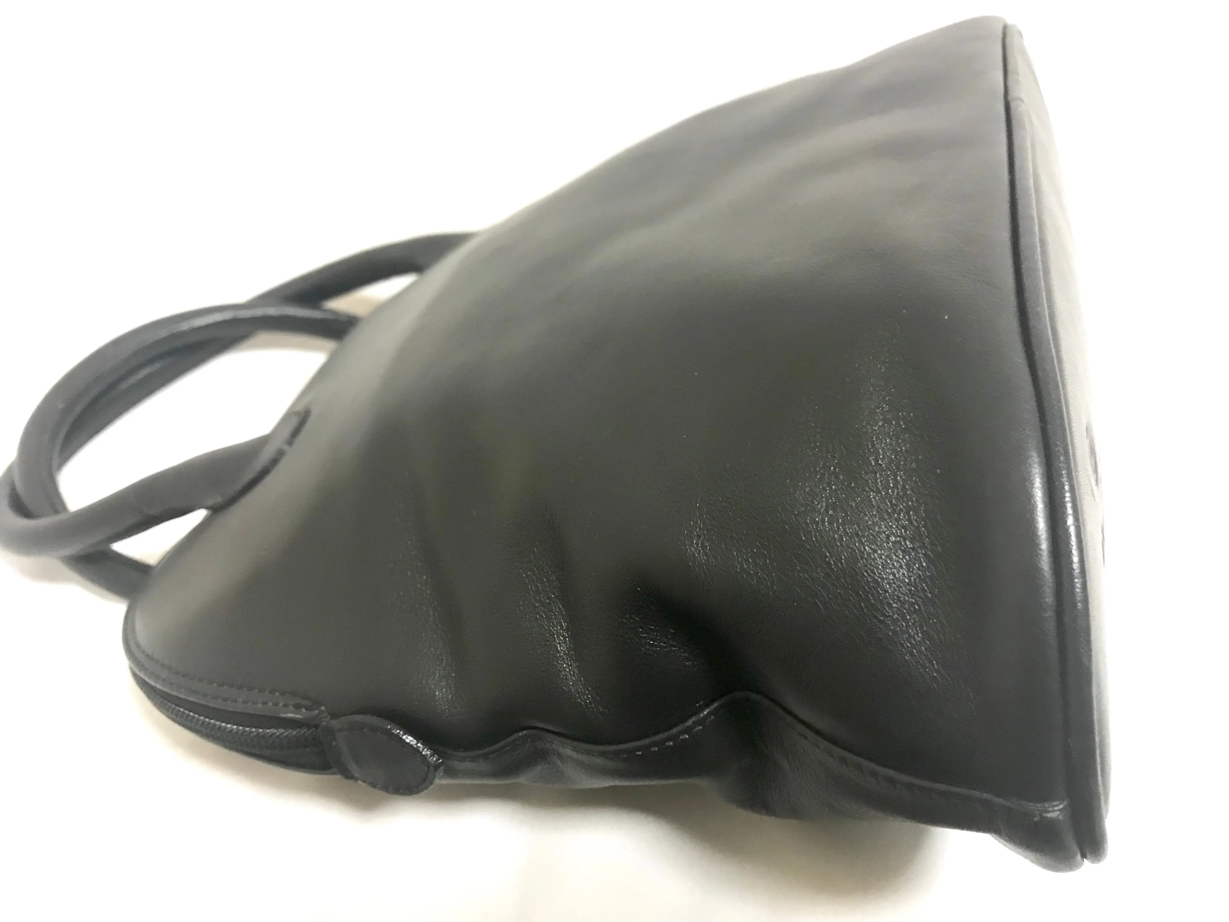 Vintage Paloma Picasso black leather bolide bag style handbag with iconic golden logo motif. Classic shape bag.