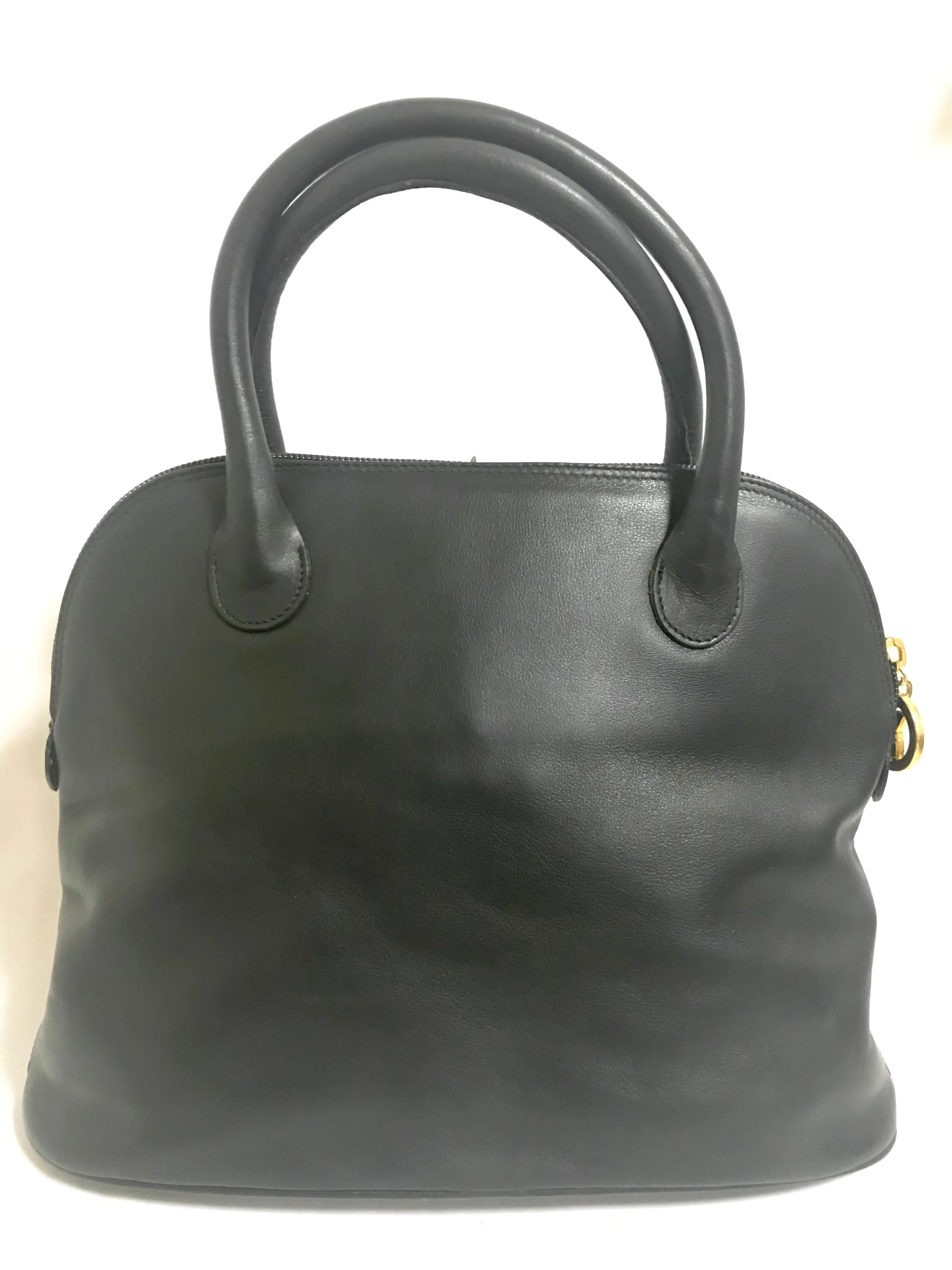 Vintage Paloma Picasso black leather bolide bag style handbag with iconic golden logo motif. Classic shape bag.